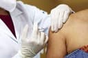 Will 130 million people have received a dose of an approved COVID-19 vaccine in the US by April 15, 2021?